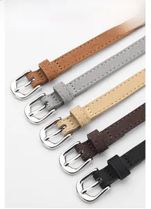 Detail of zinc alloy buckles and colorful suede thin belts for women dresses