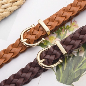 Classic woven leather belts in brown and tan with polished gold horseshoe buckles