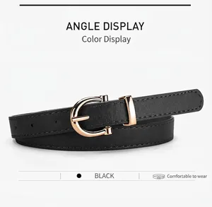 Detailed macro view of a slim black leather belt featuring a golden U-shaped buckle