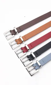 Close-up of five colorful leather belts with classic silver square buckles and neat stitching