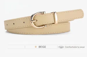 Detailed close-up of a beige faux leather skinny belt with a gold D-shaped metal buckle