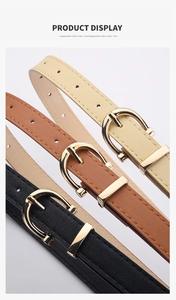 Detailed view of women's skinny belts in beige, brown and black with gold horseshoe buckles