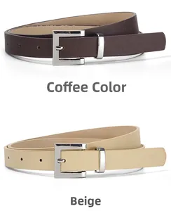 Close-up of minimalist women's leather belts in coffee and beige with silver metal buckles