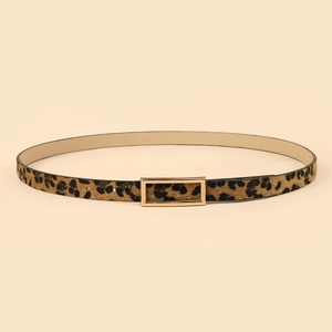 Detail of leopard print faux calf hair belt with elegant rectangular gold metal buckle