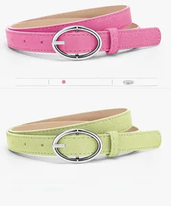 Detailed shot of minimalist suede belts in rose red and green with oval metal buckles