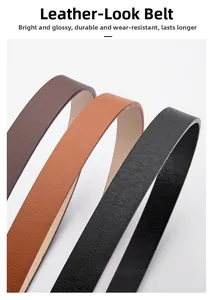 Detail of three leather belts in black and brown with fine textured matte surface