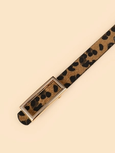 Detail of leopard print faux fur belt with minimalist gold rectangular metal buckle