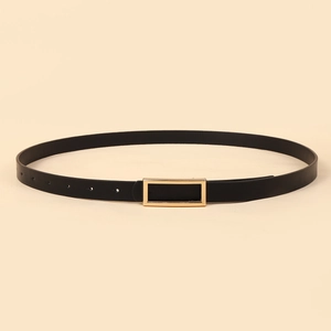 Detail view of smooth black leather belt featuring an elegant gold rectangular buckle