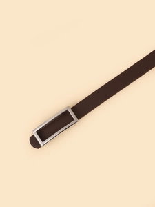 Detail of slim dark brown leather belt featuring a polished rectangular silver buckle