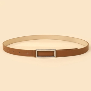 Detail of slim brown leather belt with silver rectangular buckle and neat stitching