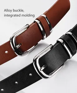 Close-up of black and brown lychee textured leather belts with silver alloy pin buckles