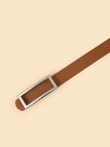 Close-up of brown litchi pattern leather belt with minimalist silver rectangular buckle