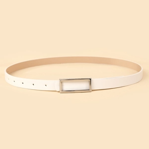 Detail view of cream white faux leather belt with a polished silver rectangular buckle