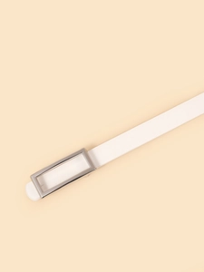 Close-up of white leather belt with polished silver rectangular buckle on neutral background