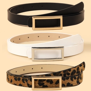 Detail view of thin women belts in black, white, and leopard print with metal buckles