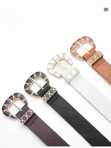 Detailed close-up of four women's PU leather belts with decorative engraved metal buckles