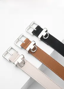 Close-up of matte slim belts with silver square buckles and D-ring charms in three colors
