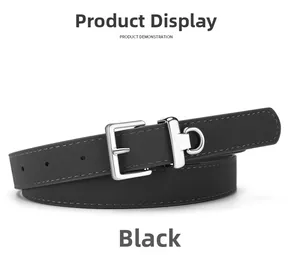 Close-up of black leather slim belt featuring silver metal pin buckle and fine stitching detail