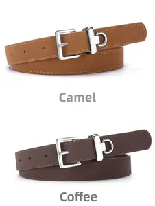 Detail view of camel and coffee brown slim leather belts with silver pin buckles and D-rings