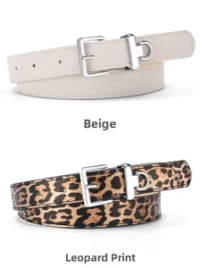 Close-up of beige and leopard print belts with silver buckles and D-ring details