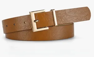 Detail of camel leather belt featuring lychee texture and golden square metal buckle