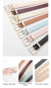 Detailed views of crocodile pattern leather belts with gold buckles and precise hole punches