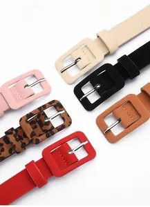 Detailed view of colorful slim fashion belts with leather textures and wrapped pin buckles