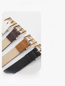 Detail of slim leather belts in four colors with golden square buckles and back stitching