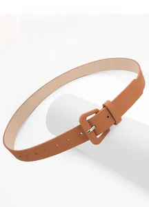 Detail view of caramel brown textured leather belt with a matching square covered buckle