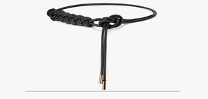 Detail of woven black leather belt with elegant rose gold metal tips and braided texture