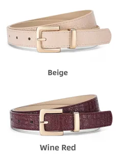 Detail of beige and wine red crocodile pattern leather belts with gold buckles