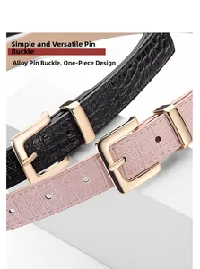 Detail of alloy pin buckle and crocodile embossed texture on trendy women's belt