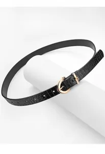 Detailed view of women's black crocodile texture PU leather belt with gold D-ring buckle