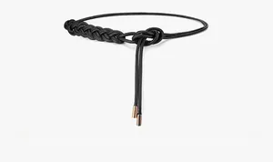 Close-up of black braided faux leather belt with rose gold metal ends for dresses