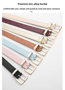 Close-up of diverse crocodile pattern leather belts with polished gold zinc alloy buckles