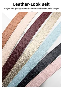 Detail shot of various faux leather belts with embossed crocodile texture in multiple colors