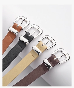 Close-up of four colorful PU leather belts with fine texture and silver square buckles