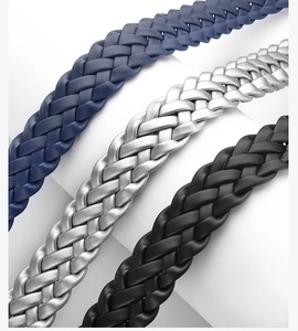 Detailed macro view of woven leather belts in deep blue, silver, and black colors