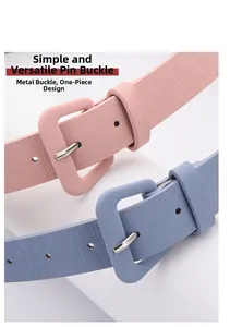 Close-up of pink and blue textured leather belts with iron square buckles and fine lychee grain