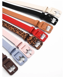 Detailed close-up of slim waist belts in various colors and trendy leopard print style