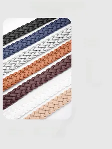 Close-up of multicolored braided leather belts with intricate stitching and vintage textures