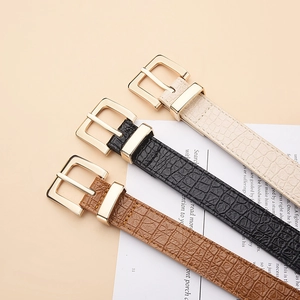 Three crocodile pattern belts in beige, black, and brown with golden square buckles