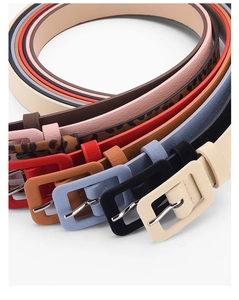 Detailed close-up of colorful women's skinny belts with matching leather-wrapped buckles