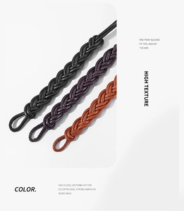 Detail of woven faux leather waist belts in black, deep purple, and tan colors