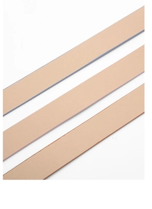 Detail shot of beige leather belts showing natural grain texture and smooth edges