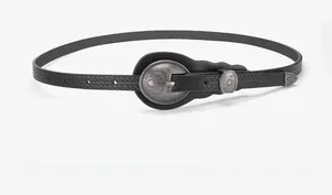 Detail of vintage black belt with western engraved buckle and braided texture