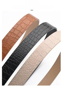 Detailed macro view of crocodile embossed pattern on high-quality faux leather belts