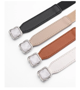 Detailed view of elastic waist belts in four colors with square faux-marble buckles