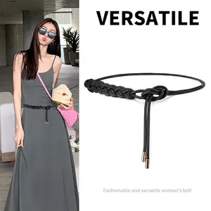 Women's black woven thin waist belt with elegant metal tips and adjustable rope design