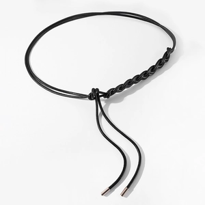 Slim black woven waist belt with metallic tips for dresses and sweaters